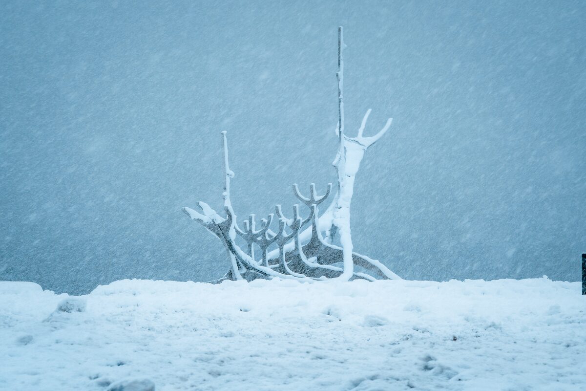 Snow-covered Sun Voyager sculpture on the Reykjavik waterfront.