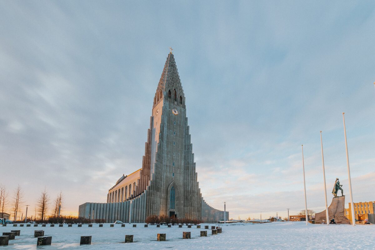 Hallgrímskirkja Church in snowy Reykjavik at sunset.