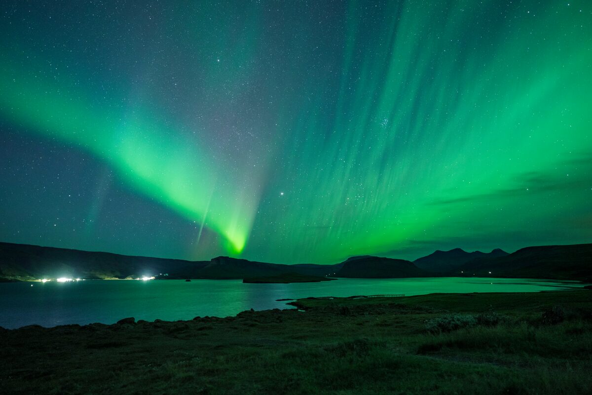 Northern Lights over Hvalfjörður in West Iceland at night.