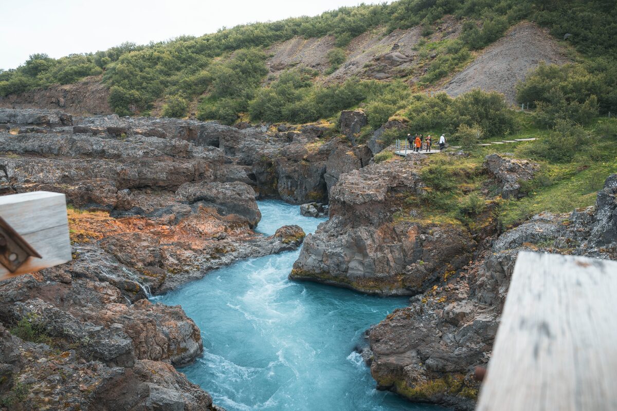 Barnafoss blue rapids rushing through a rocky channel in Borgarfjörður.