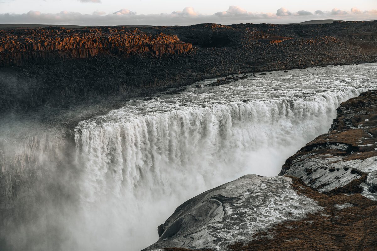 Dettifoss waterfall crashing into a canyon with basalt cliffs in northeast Iceland.