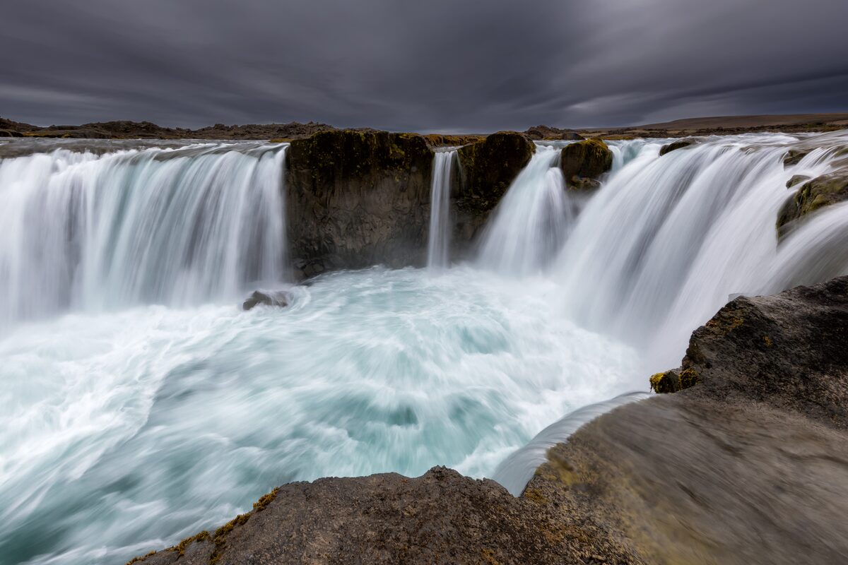 Hrafnabjargafoss splits around a central rock into two cascades on the Skjálfandafljót river.