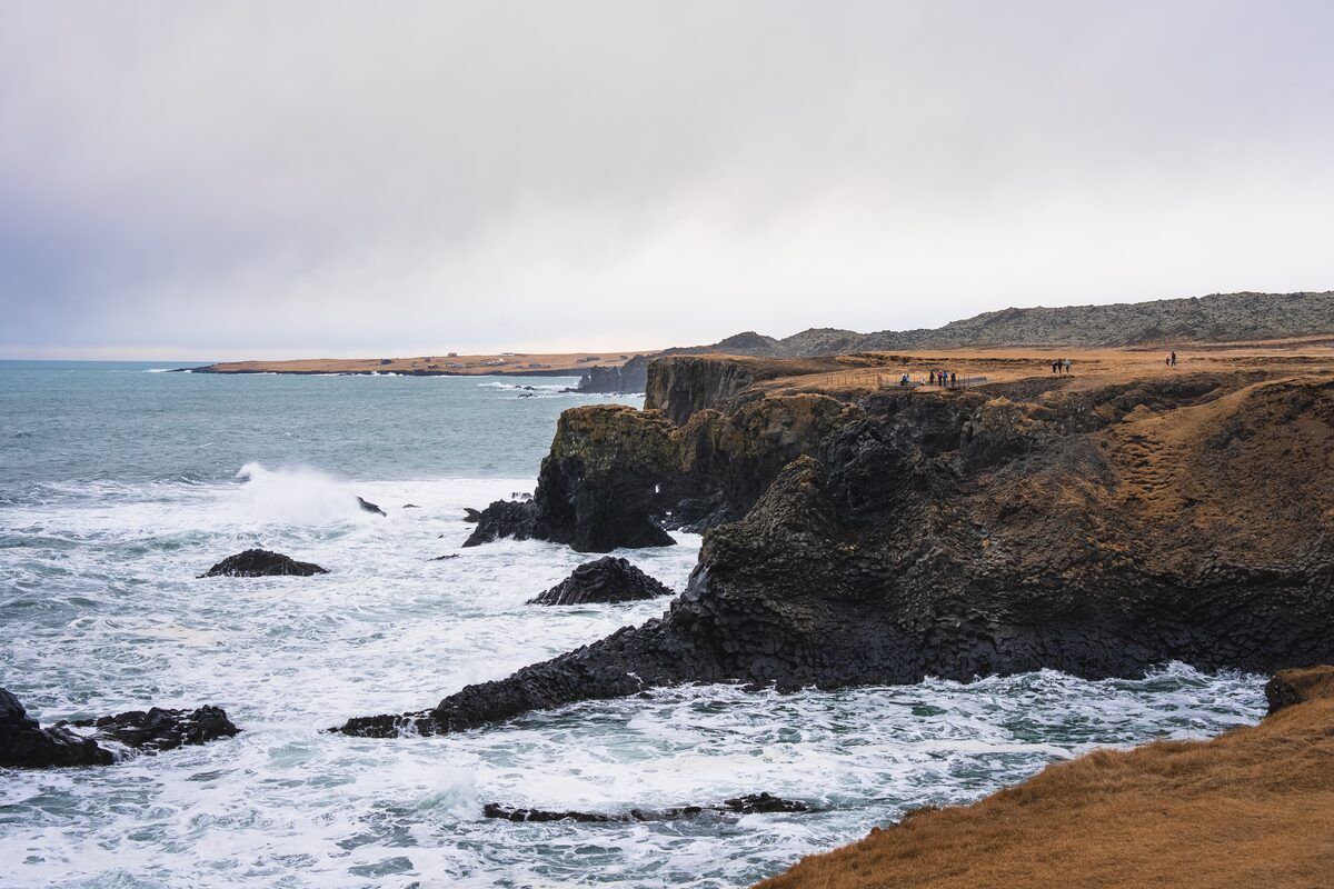 Basalt sea cliffs and crashing surf along the Arnarstapi to Hellnar coastal trail, Snæfellsnes.