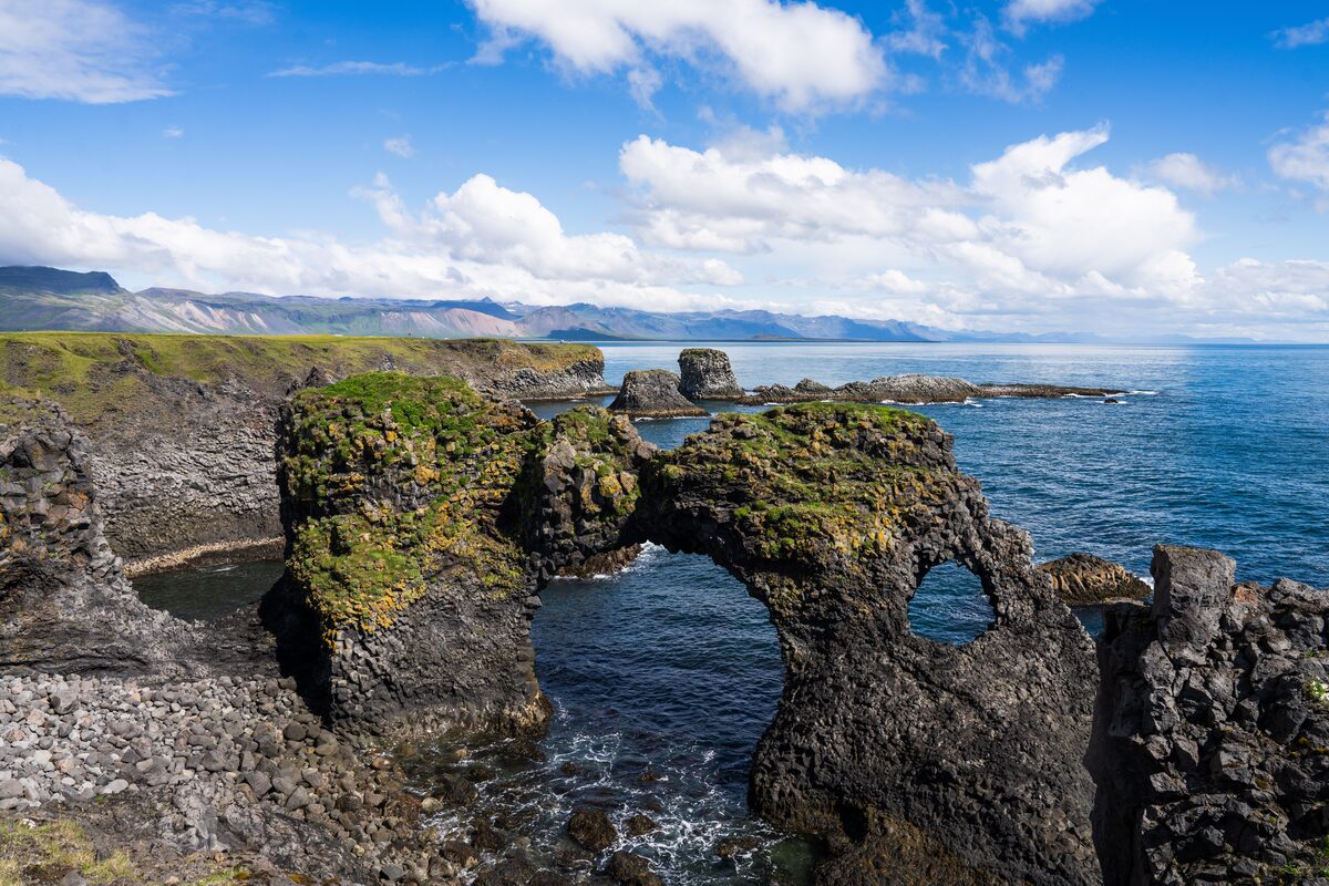 Gatklettur rock arch in the sea between Arnarstapi and Hellnar, Snæfellsnes Peninsula.