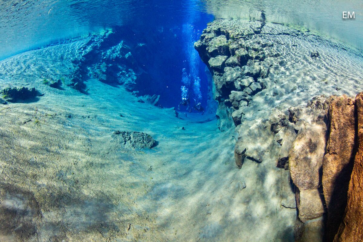 Two Divers Next To Each Other In Silfra in Iceland