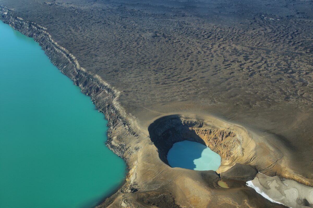 Víti crater at Askja with milky-blue geothermal water and the Öskjuvatn lake.
