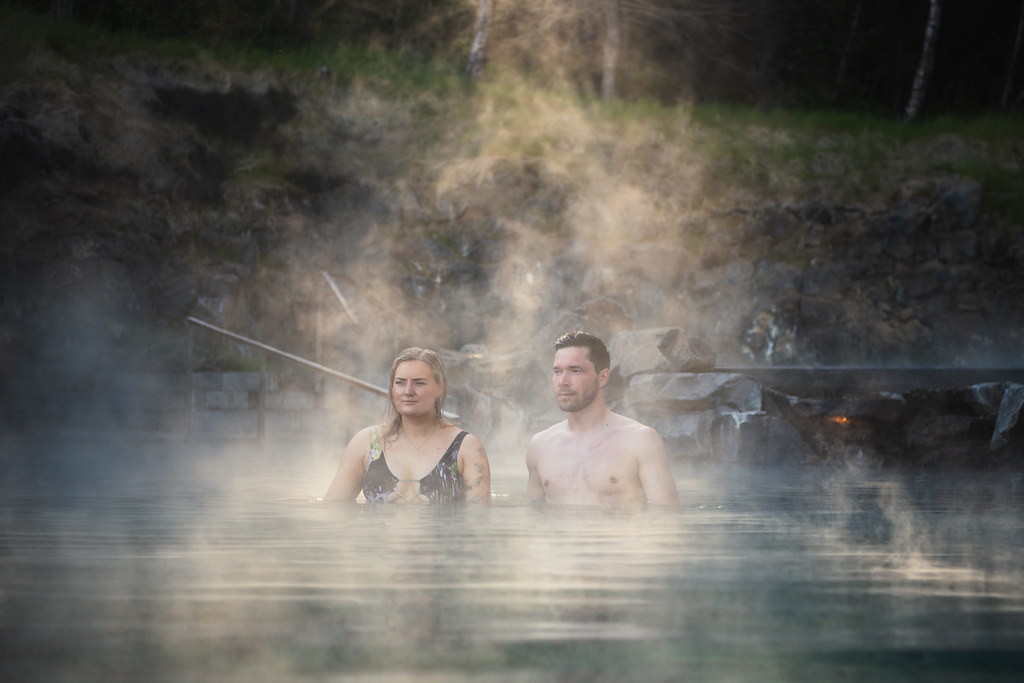 Couple In A Steamy Forest Lagoon in Iceland