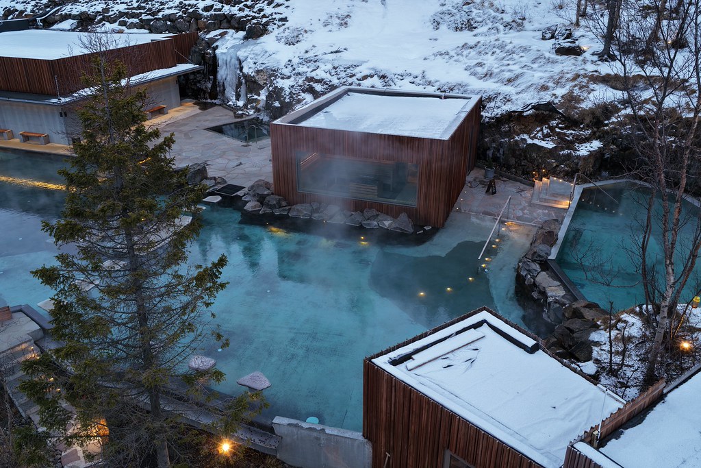 Forest Lagoon Pool And Sauna In Winter in Iceland