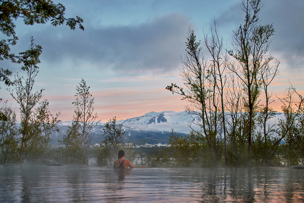 Woman At Forest Lagoon With Mountain View in Iceland