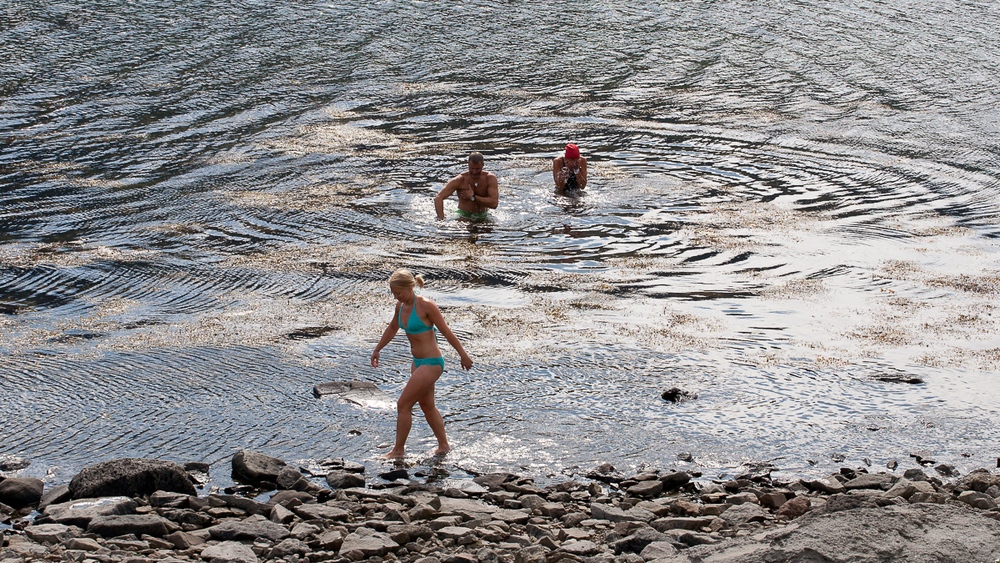 People Bathing In A River At Hornstrandir in Iceland