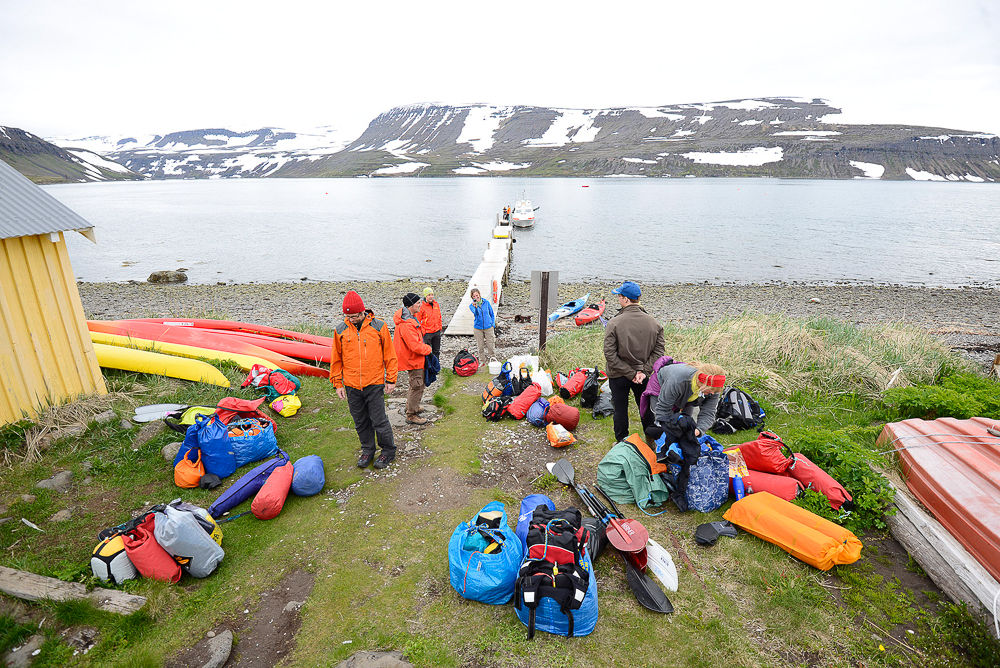 People Getting Ready For Kayaking Near A Bridge And Water in Iceland