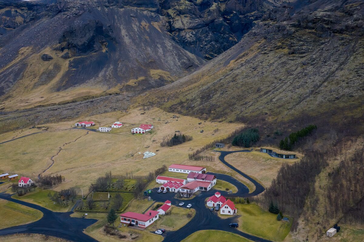 Hotel Hof building with surrounding mountain views.