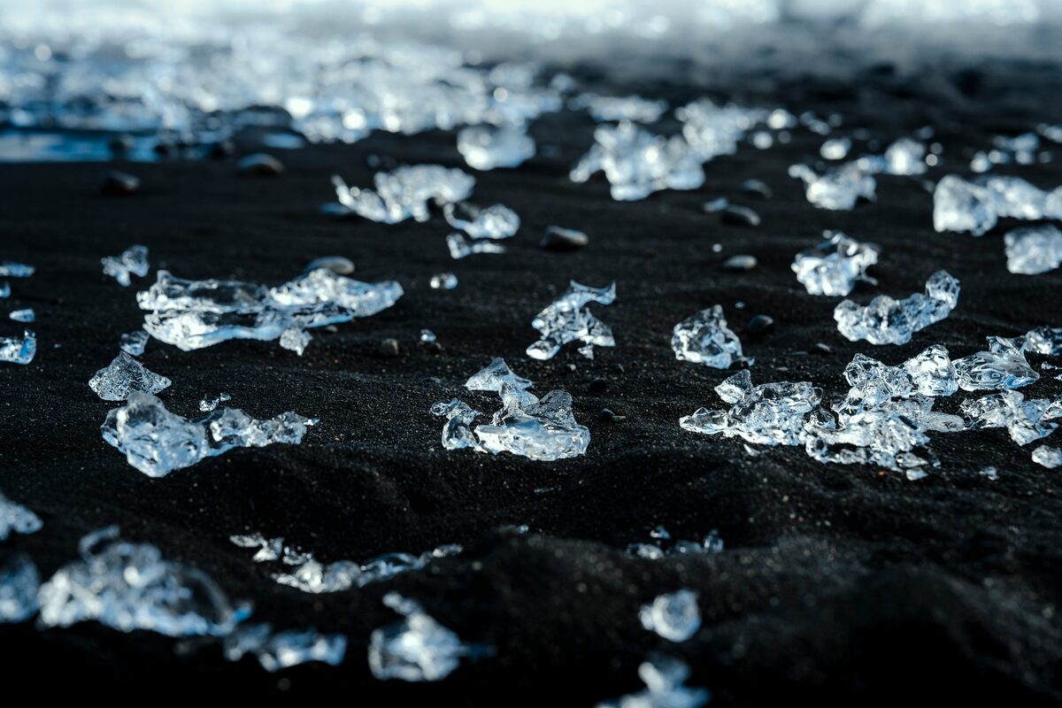 Newly washed-up clear blue ice on Diamond Beach sand.