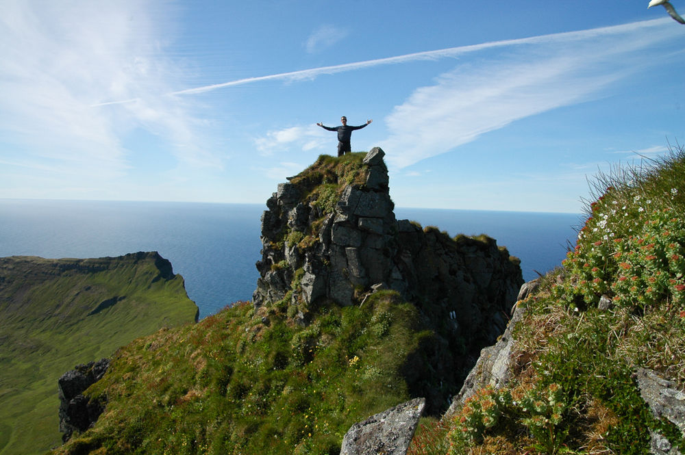 Man On A Cliff Spreading His Arms in Iceland