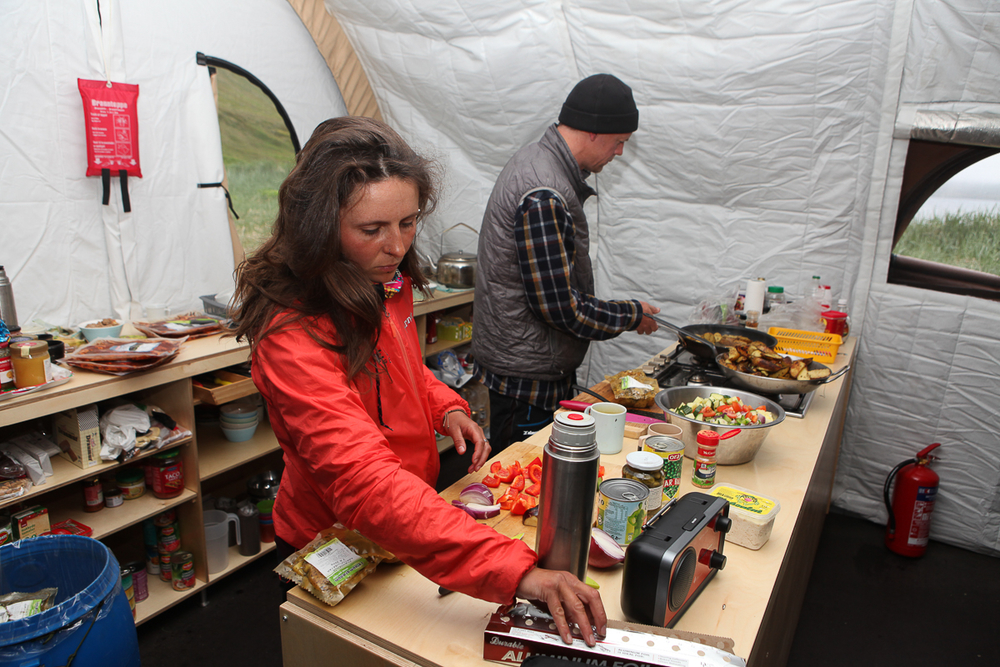 People Cooking Inside A Big Tent in Iceland