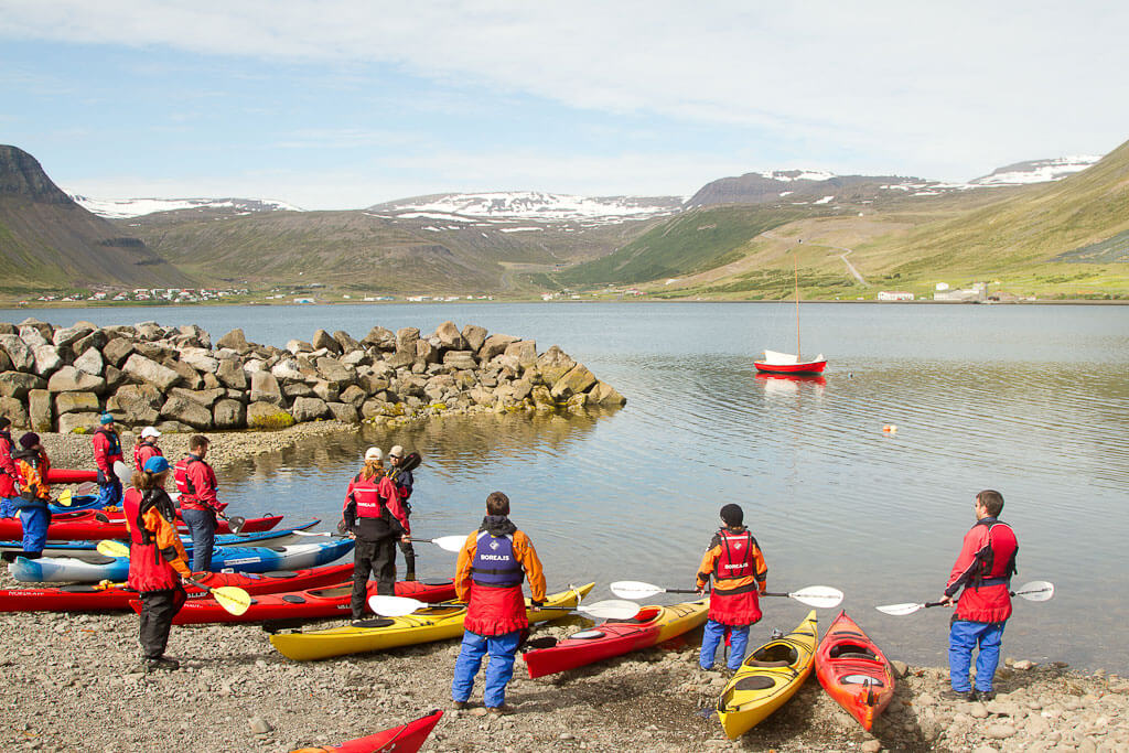 Kayakers Preparing To Go Kayaking On The Shore