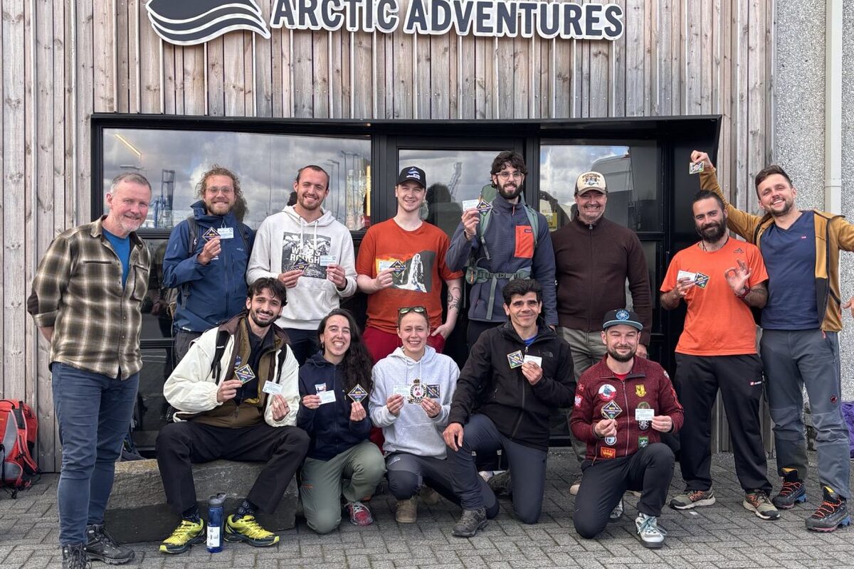 Arctic Adventures trekking guides holding Wilderness First Responder certification cards