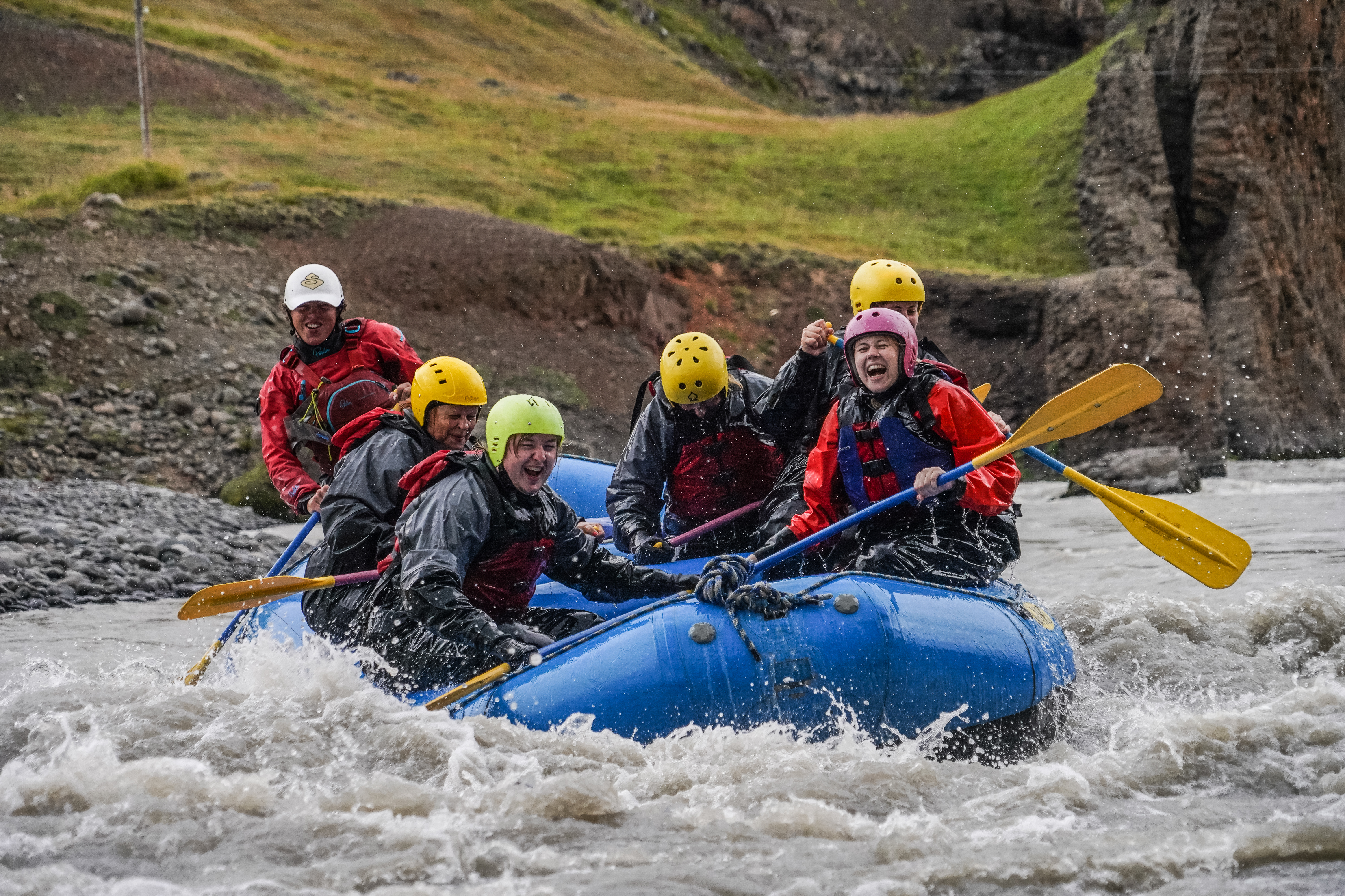 Group Tour Of Water Rafting With People Laughing in Iceland