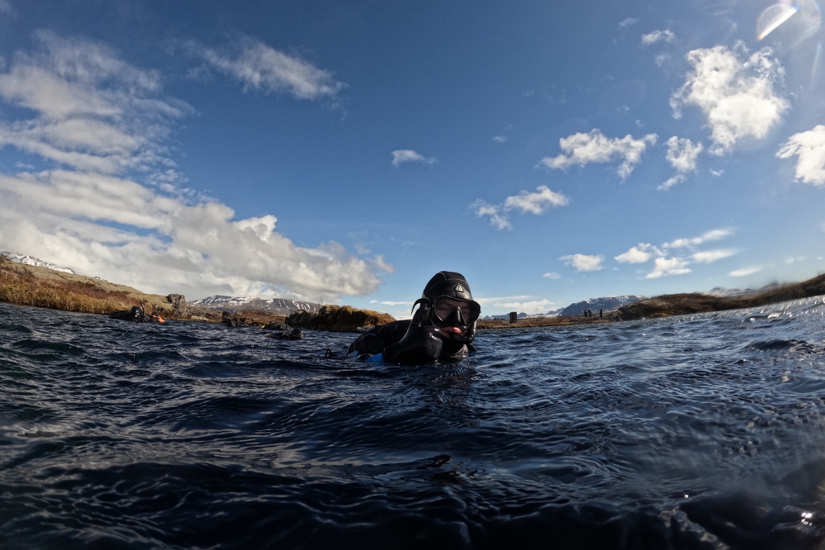 Justyna Zajkovska, Copywriter at Arctic Adventures, snorkeling in the Silfra fissure at Þingvellir National Park.