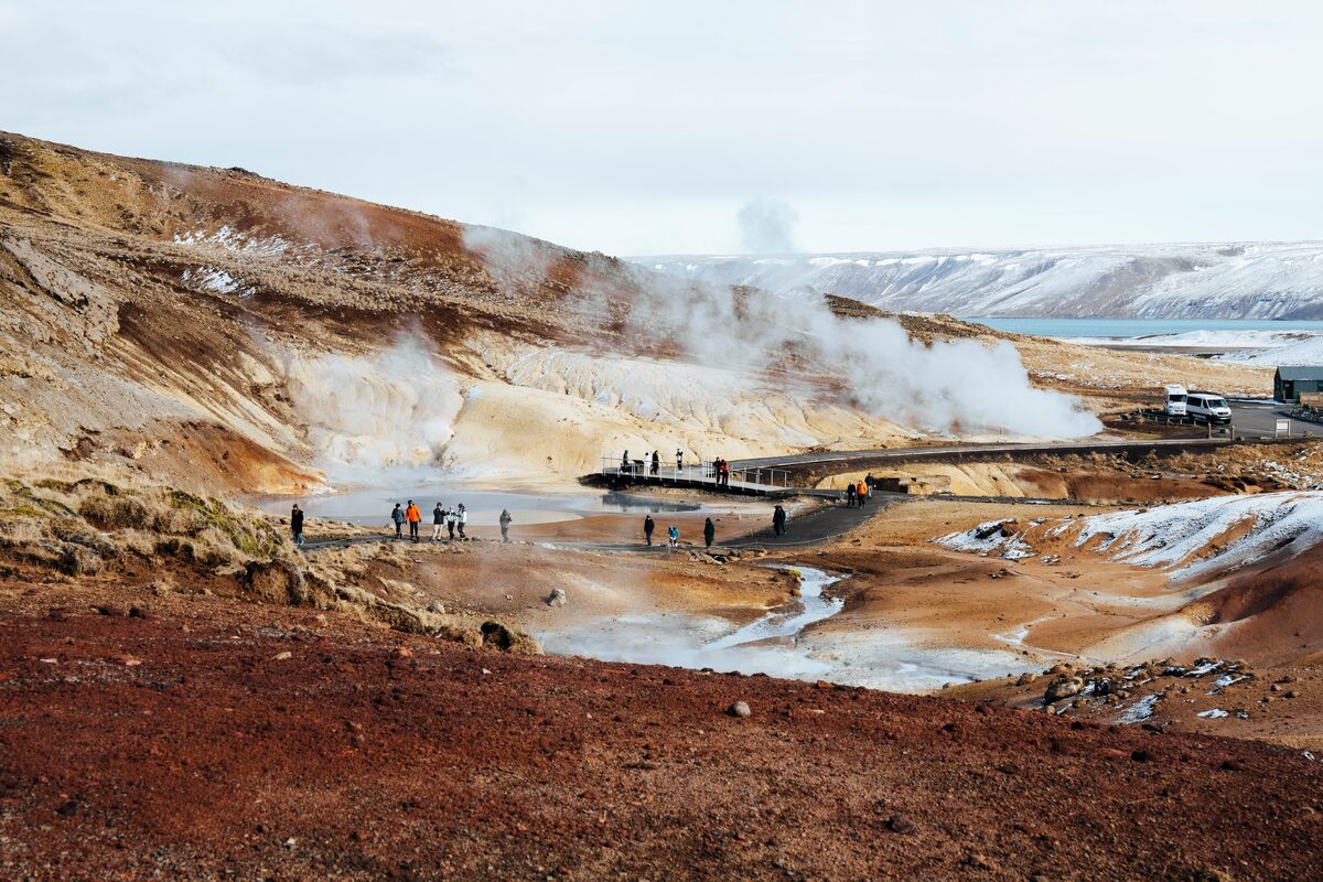 Tourists Walking Around Steamy Seltun Geothermal Area in Iceland