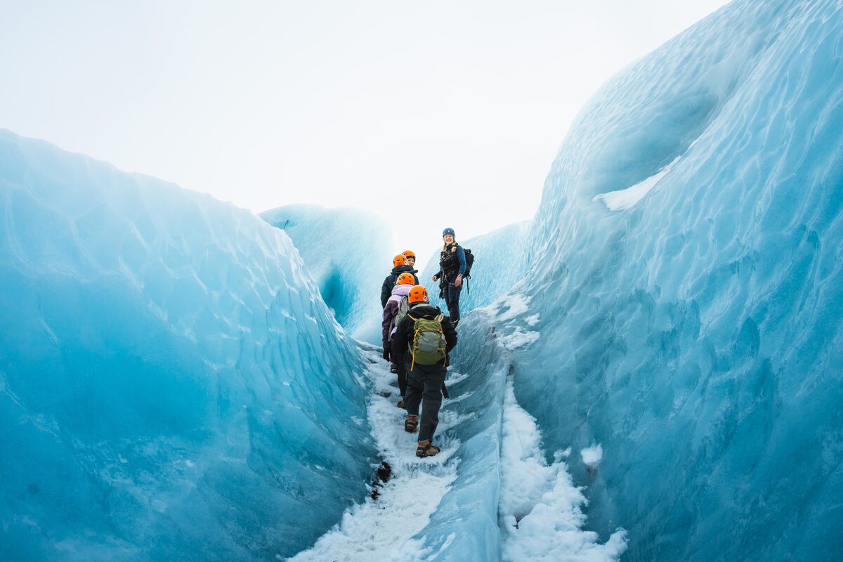 Group walking up blue ice stairs through the labyrinth