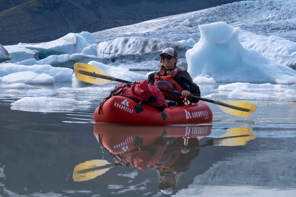 Woman In A Red Kayak In Fjallsarlon Glacier Lagoon in Iceland