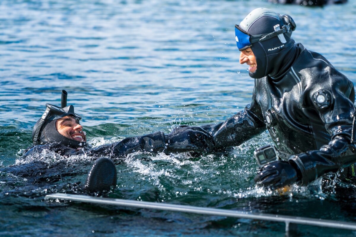 People In Water Getting Ready For A Snorkeling Tour in Iceland