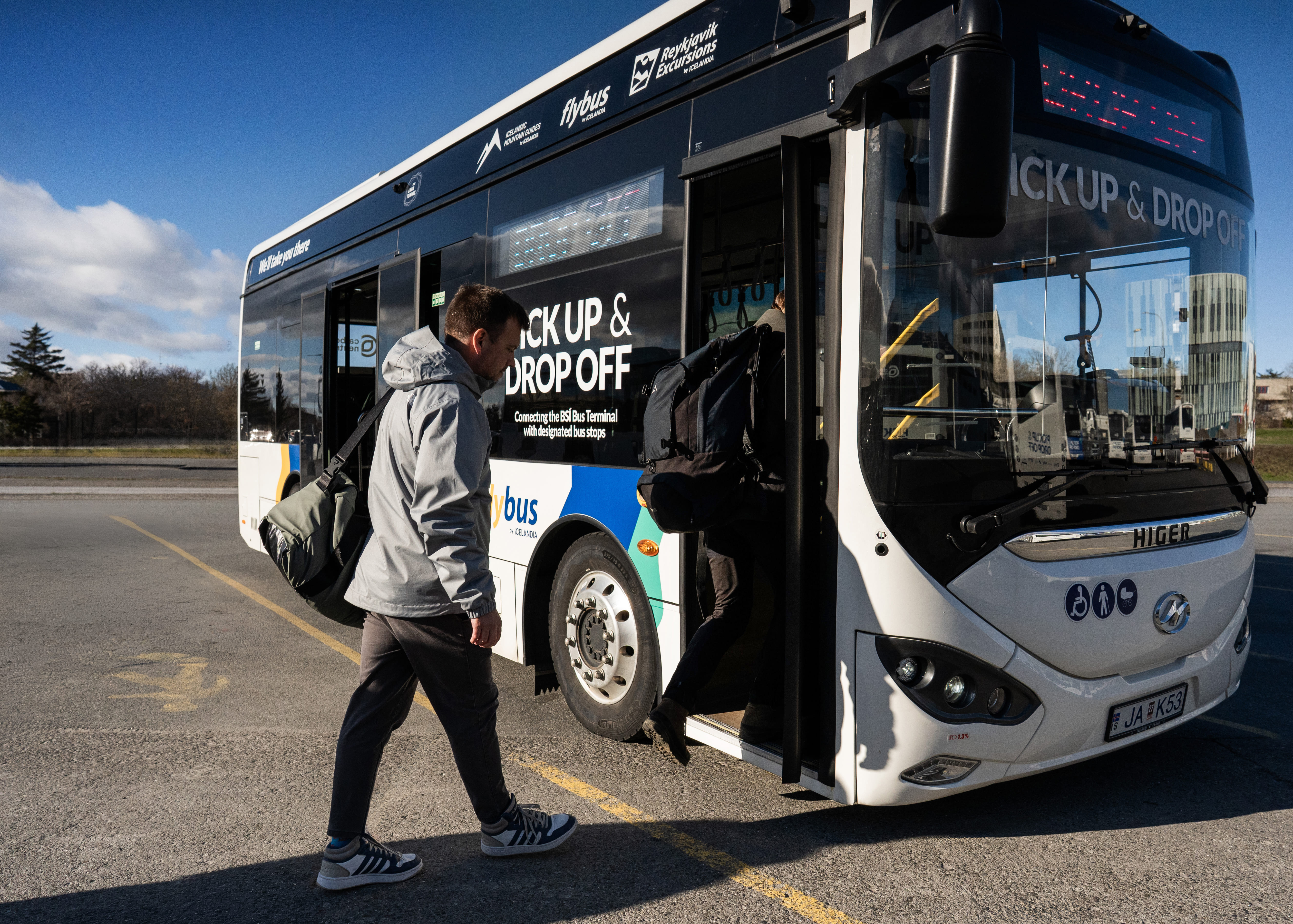 People Getting On Board Of A Flybus Bus in Iceland