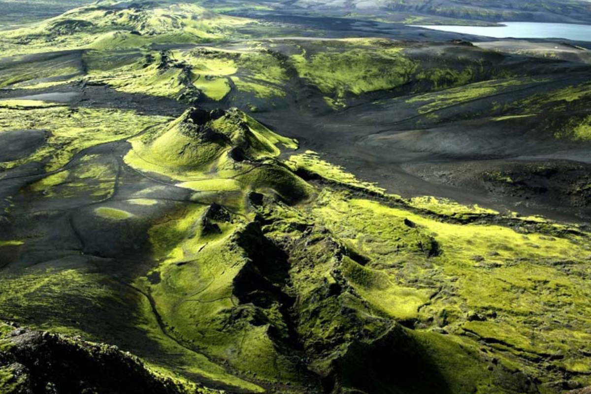 Bright green moss covered mountain terrain in Laki crater area.