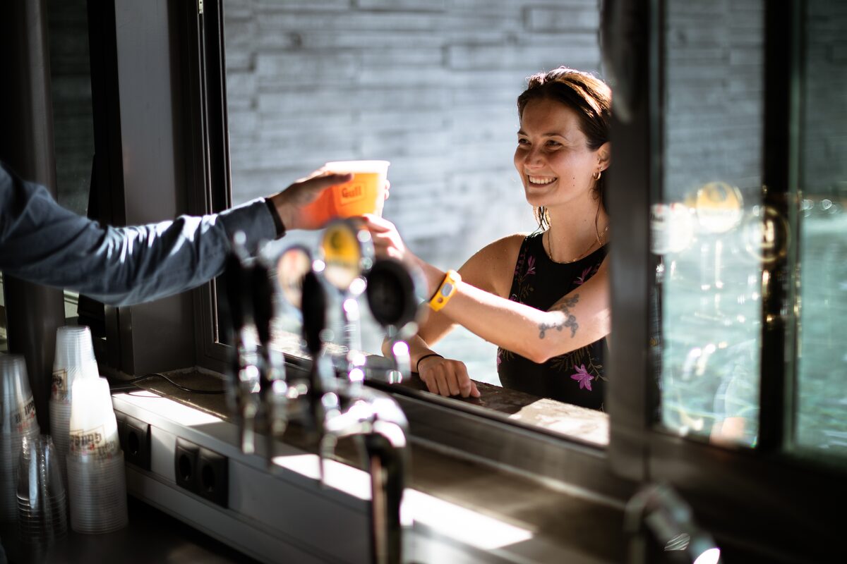 Person Getting A Drink At Geosea Hot Springs in Iceland