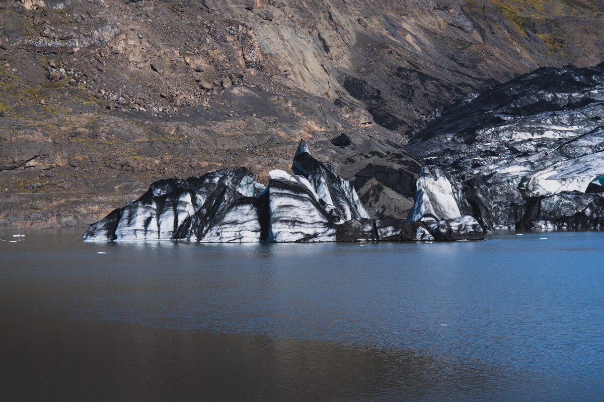 Dark ashy toned glacier crevasses at Solheimajokull glacier.