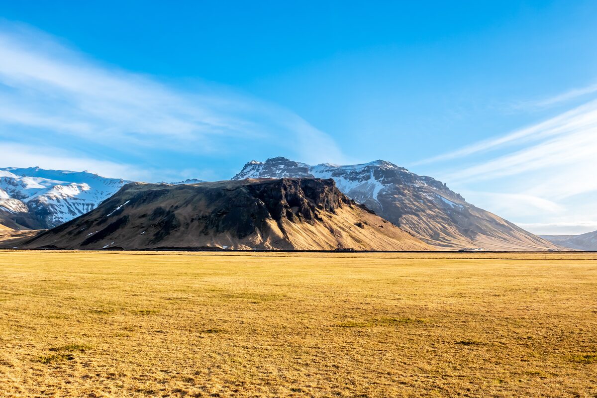 Eyjafjallajökull above a grassy plain in South Iceland.