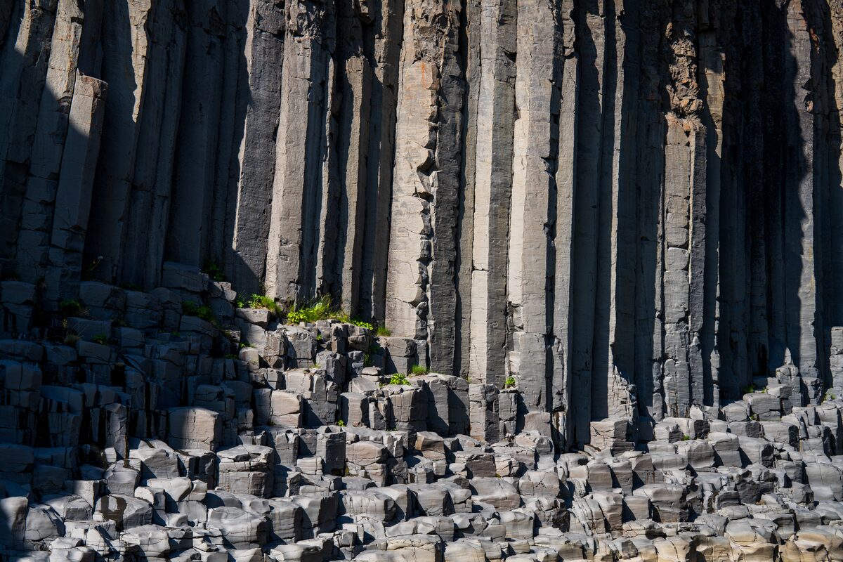 Close view of broken basalt columns showing hexagonal cross sections