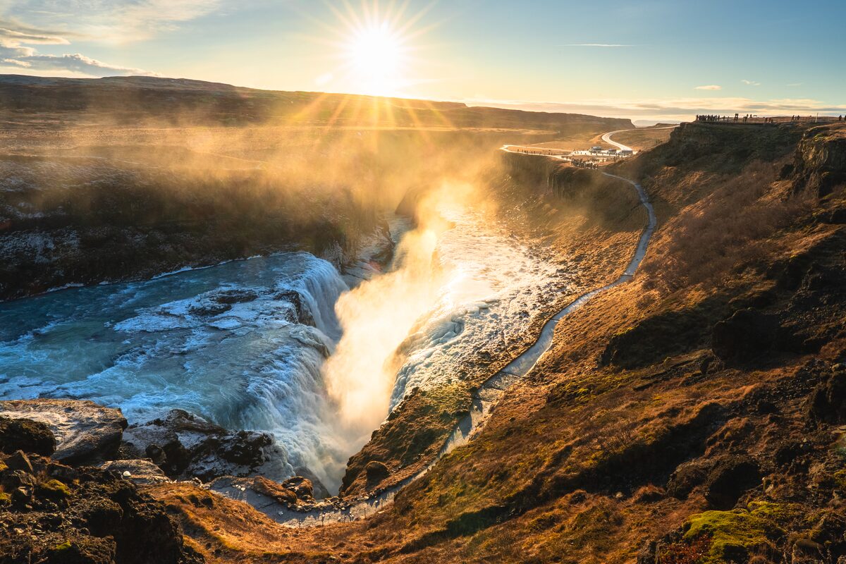 Gullfoss waterfall with crashing flow of water during sunset in winter