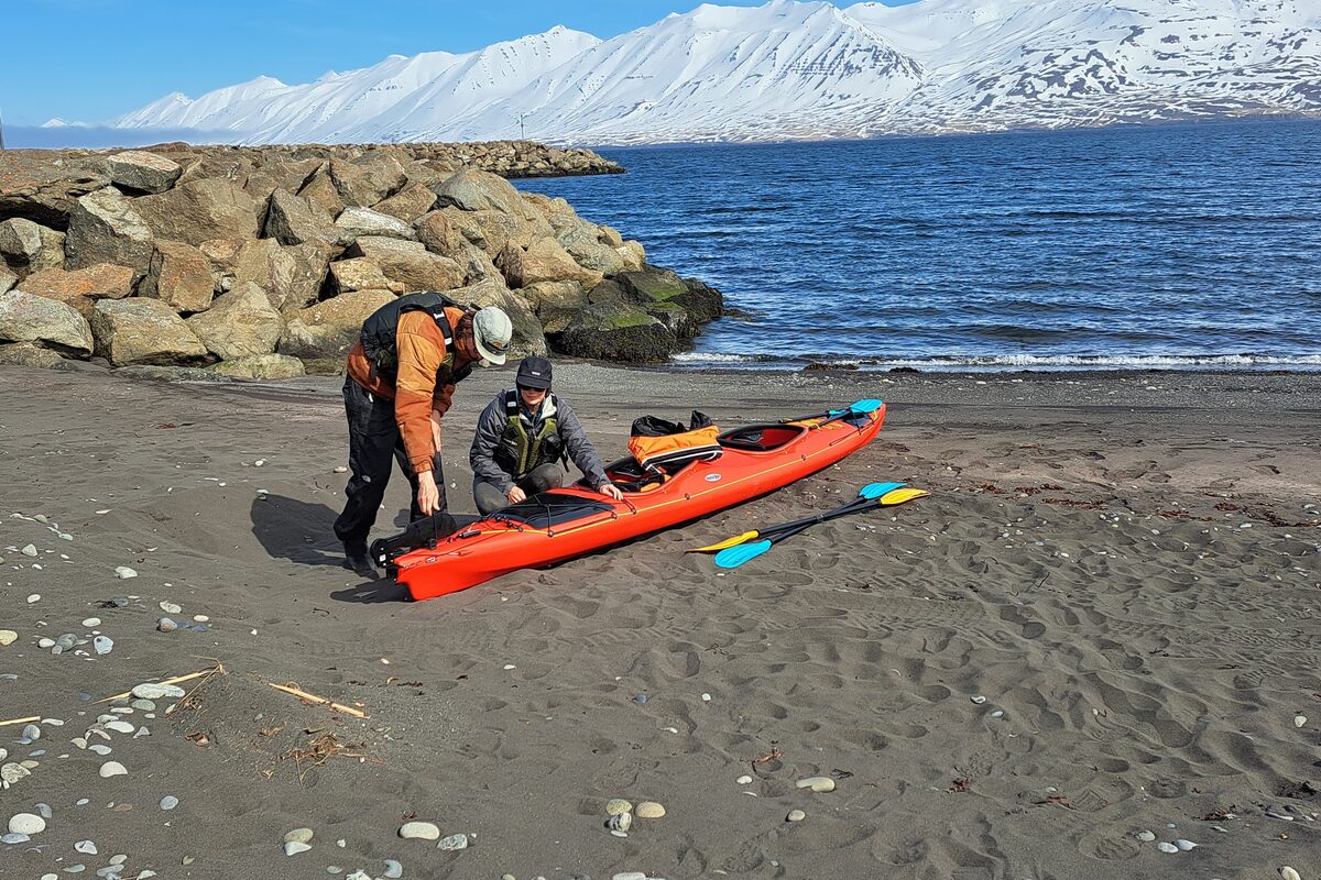People Getting Ready For A Kayaking Expedition At The Shore in Iceland