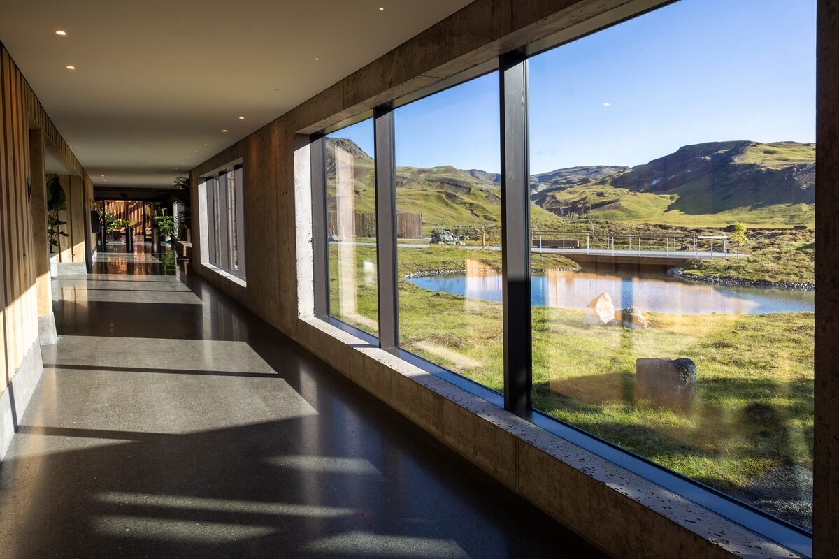 Hallway Of Reykjaböð Hot Springs With Outside View From A Window in Iceland