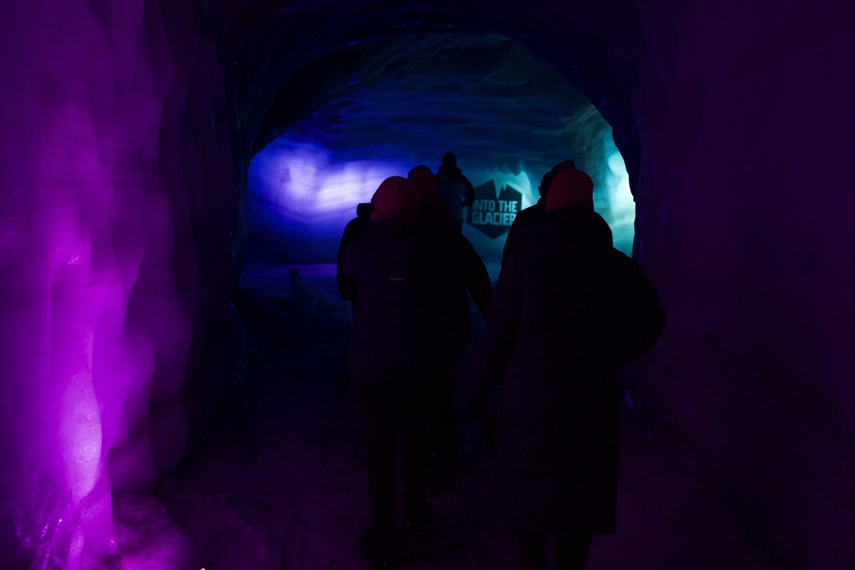 People And Pink Lights For Pink October In Into The Glacier in Iceland