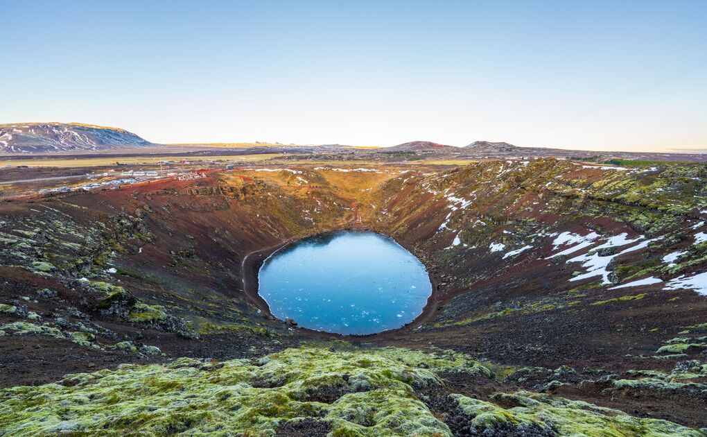 Aerial view of Kerid volcanic crater lake in early winter.