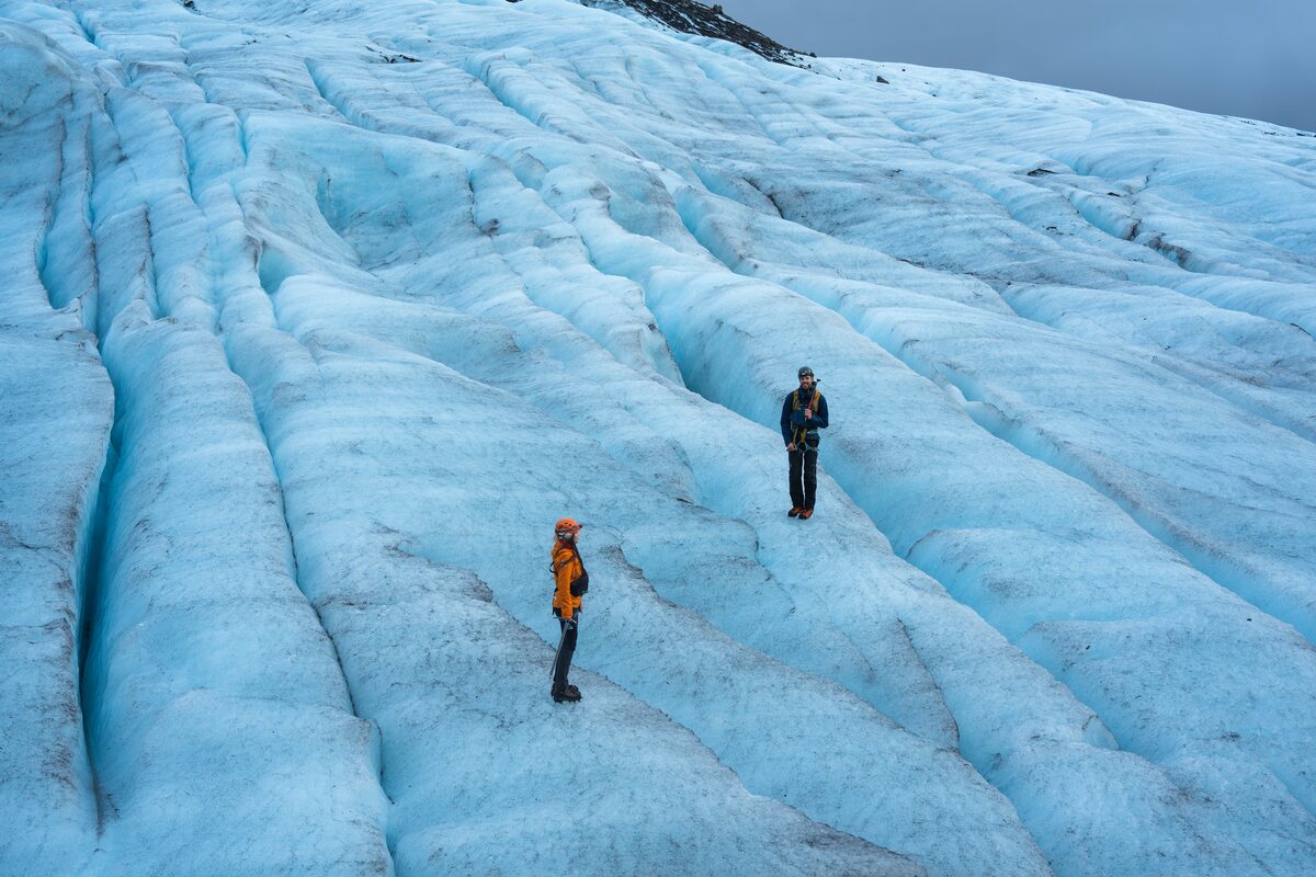 People Standing On Falljokull Glacier Near Crevasses in Iceland