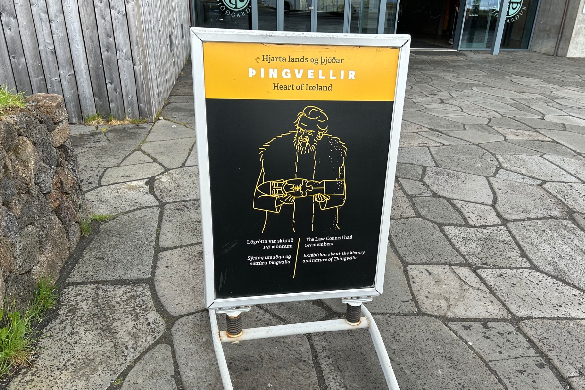 Þingvellir exhibition sign with Icelandic and English text outside the visitor center.