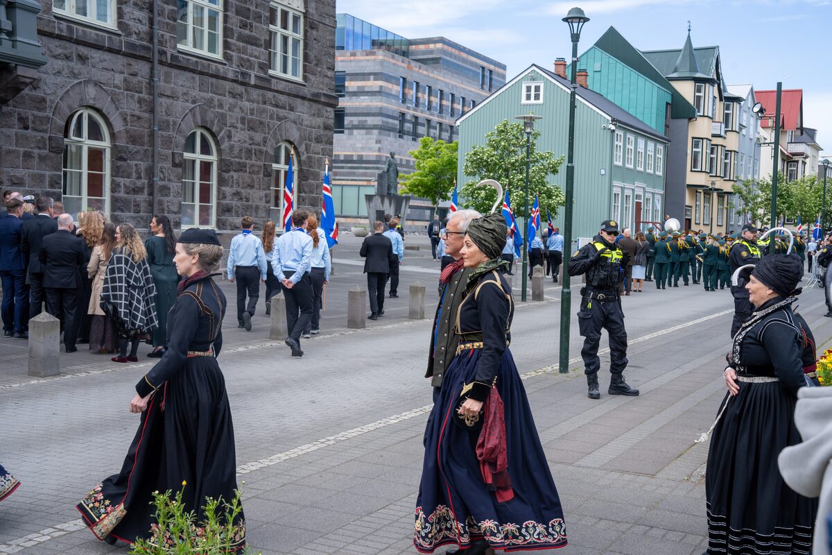 Women in black Icelandic national costumes walk through central Reykjavík during June 17 celebrations.