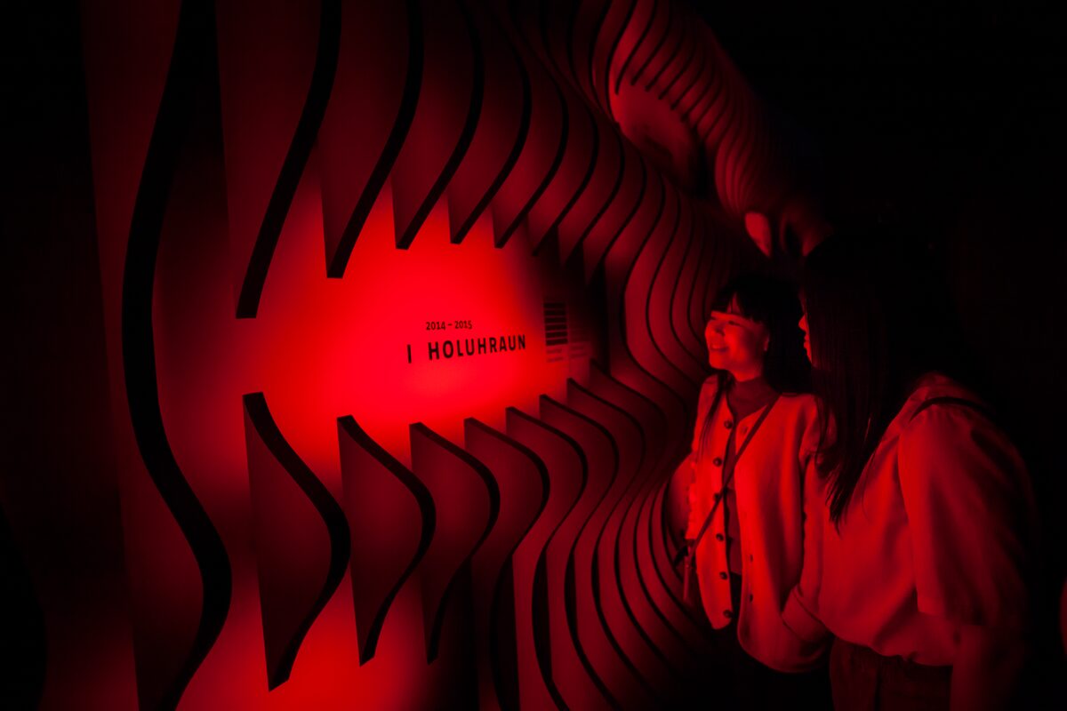 Girls Looking At An Instilation At Lava Centre in Iceland