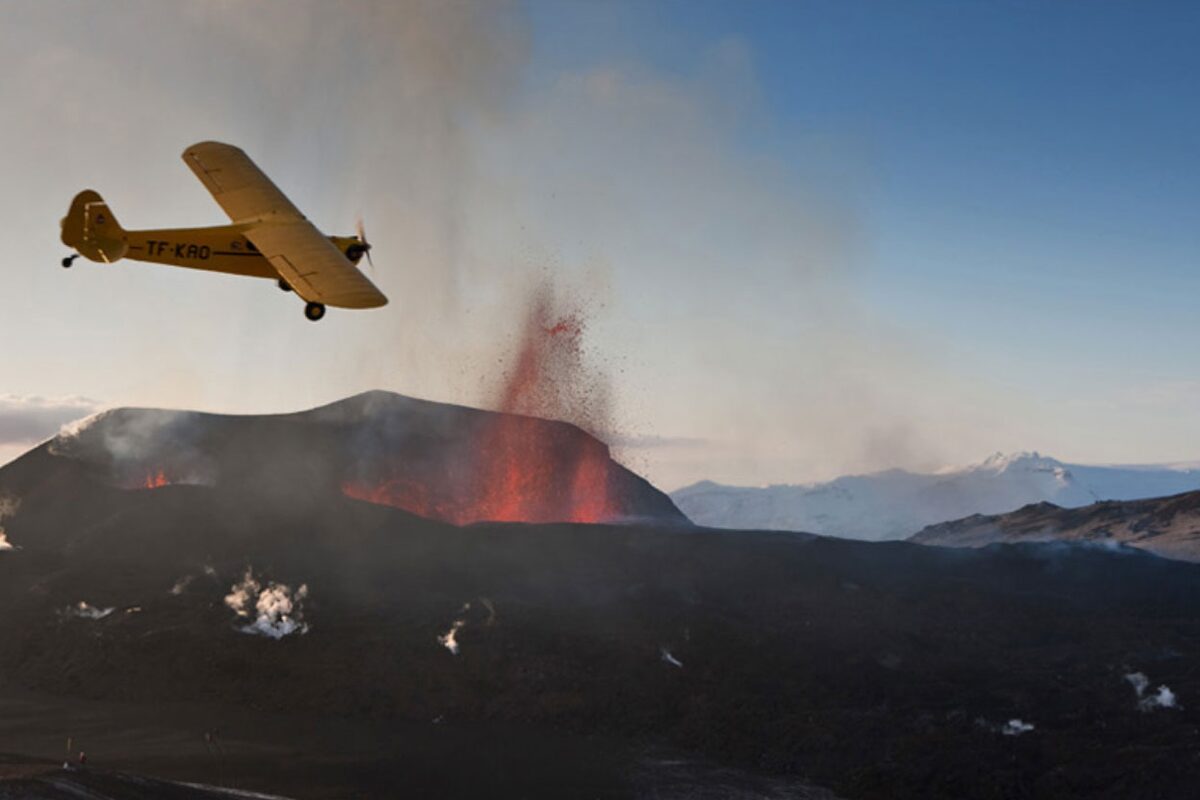 Plane Flying Over Erupting Lava in Iceland