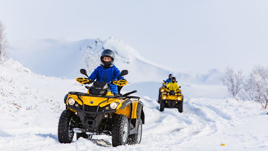 people driving ATV during winter