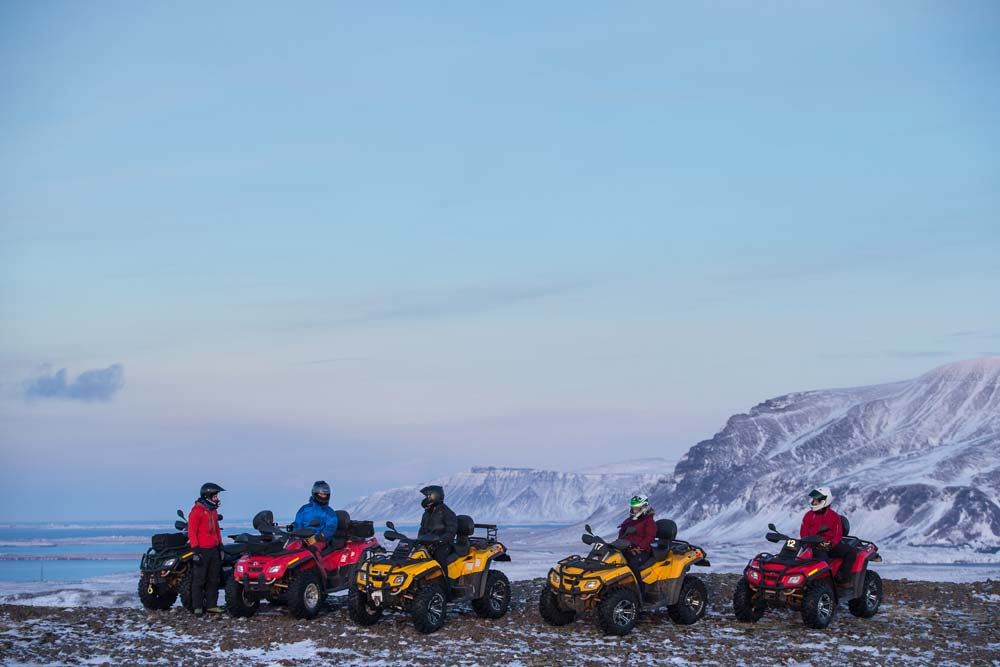 group of people driving ATV