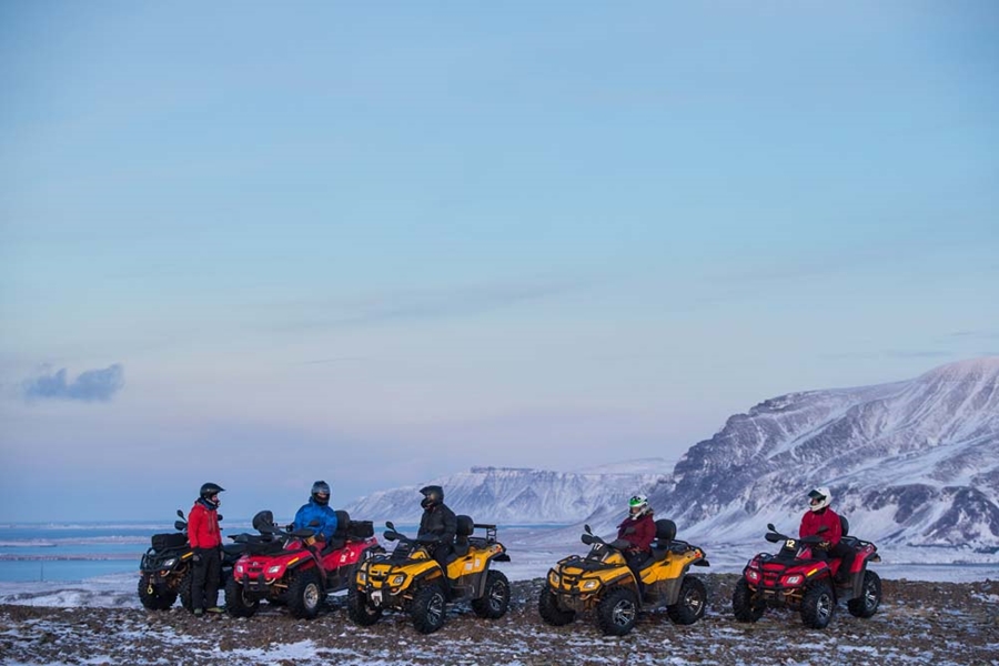 group of people driving ATV