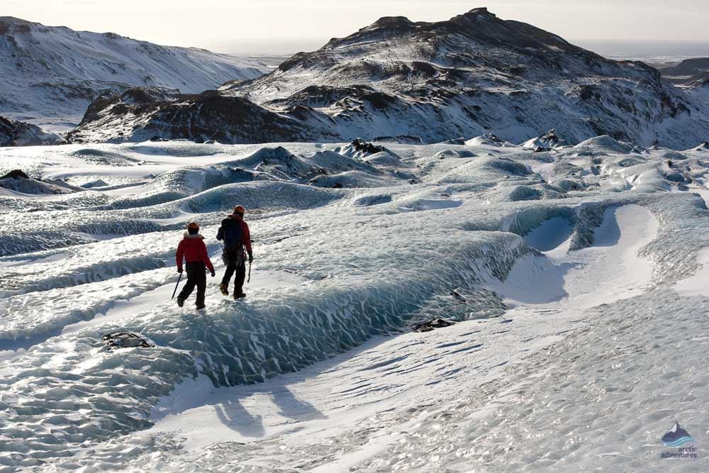 people walking on glacier ice
