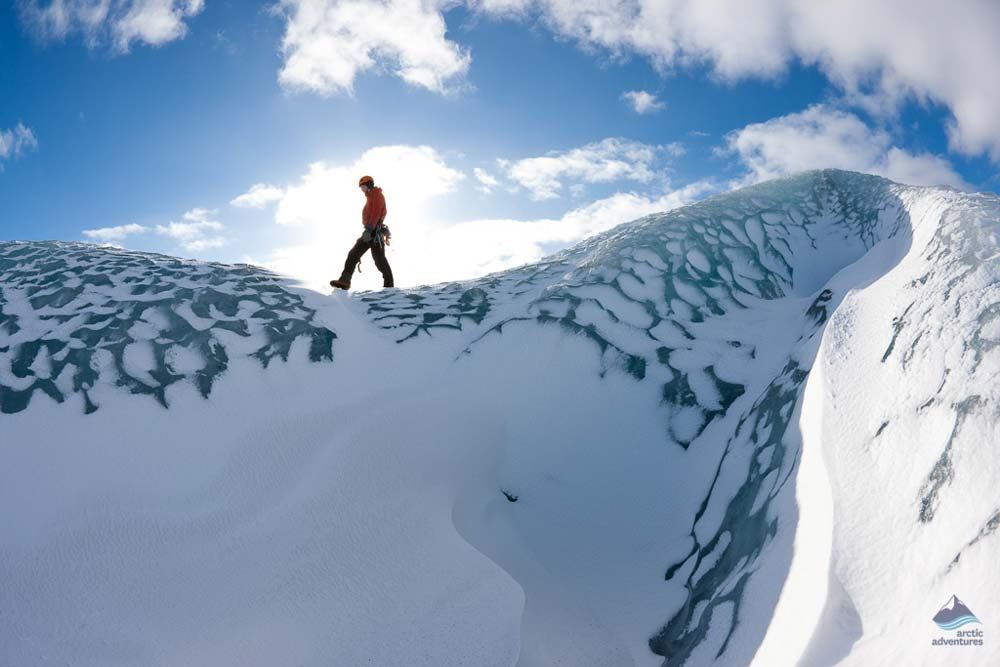 woman walking on a glacier