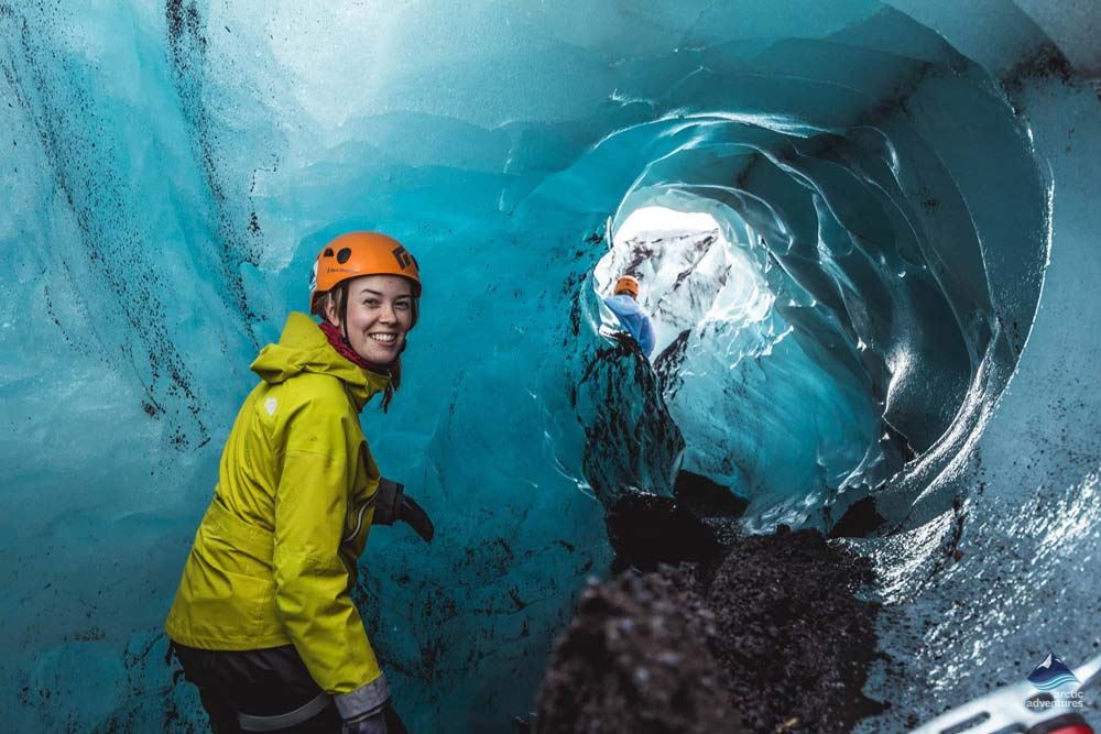happy woman inside ice cave