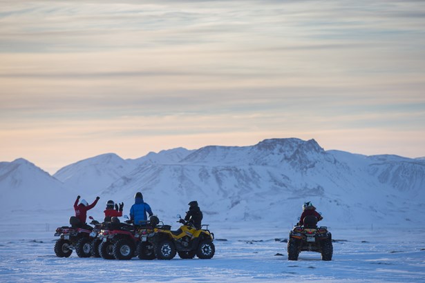 people having fun riding ATV's in winter